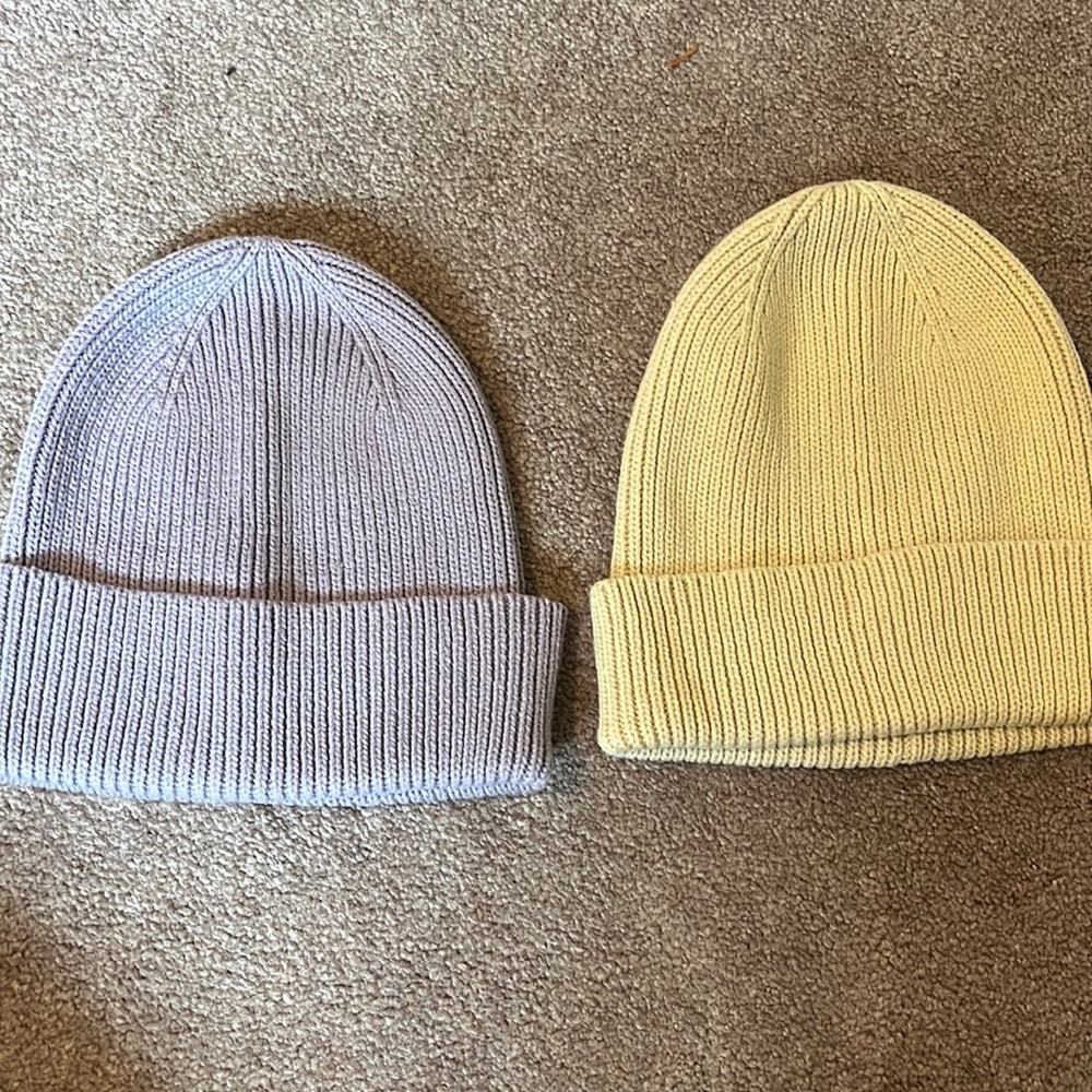 Two hats from GAP. Purple one still has tags. Cream one worn once.